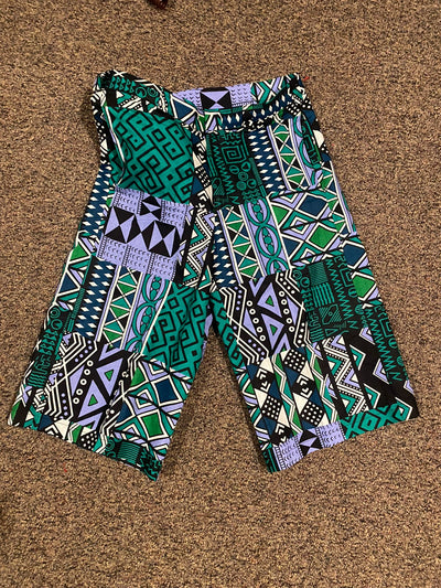 Cool color print of shorts with a vibrant and lively pattern. The shorts hit above the knee and are perfect for anyone looking for a pop of color in their outfit.