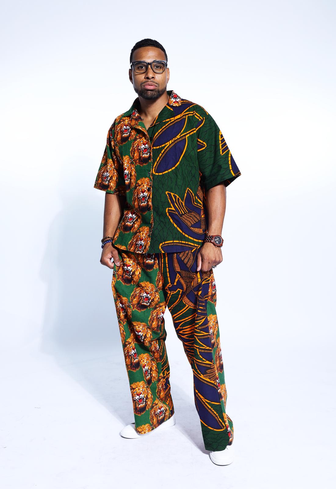 Unisex Igbo Traditional multi-colored Isi Agu shirt and pants set featuring bold lion prints, perfect for weddings, dinner parties, and formal occasions.