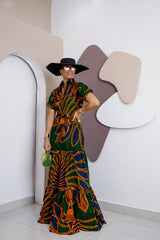 Model wearing Anaobi Kaftan Maxi Dress in bold green, orange, and navy Ankara print