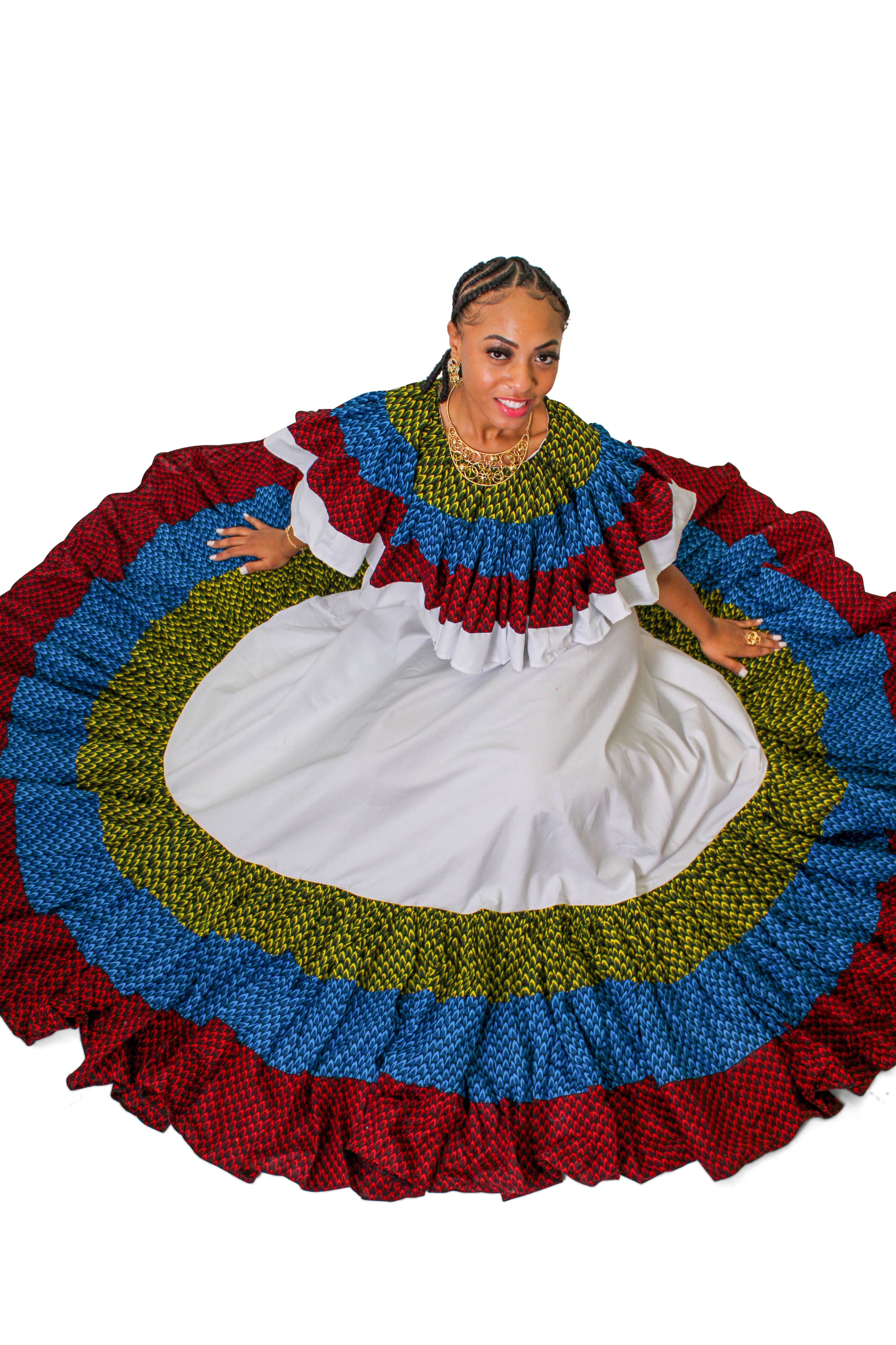 Woman wearing the Ighiligi Ruffle Dancing Dress with multicolor African ruffle detailing around the neckline and hem.