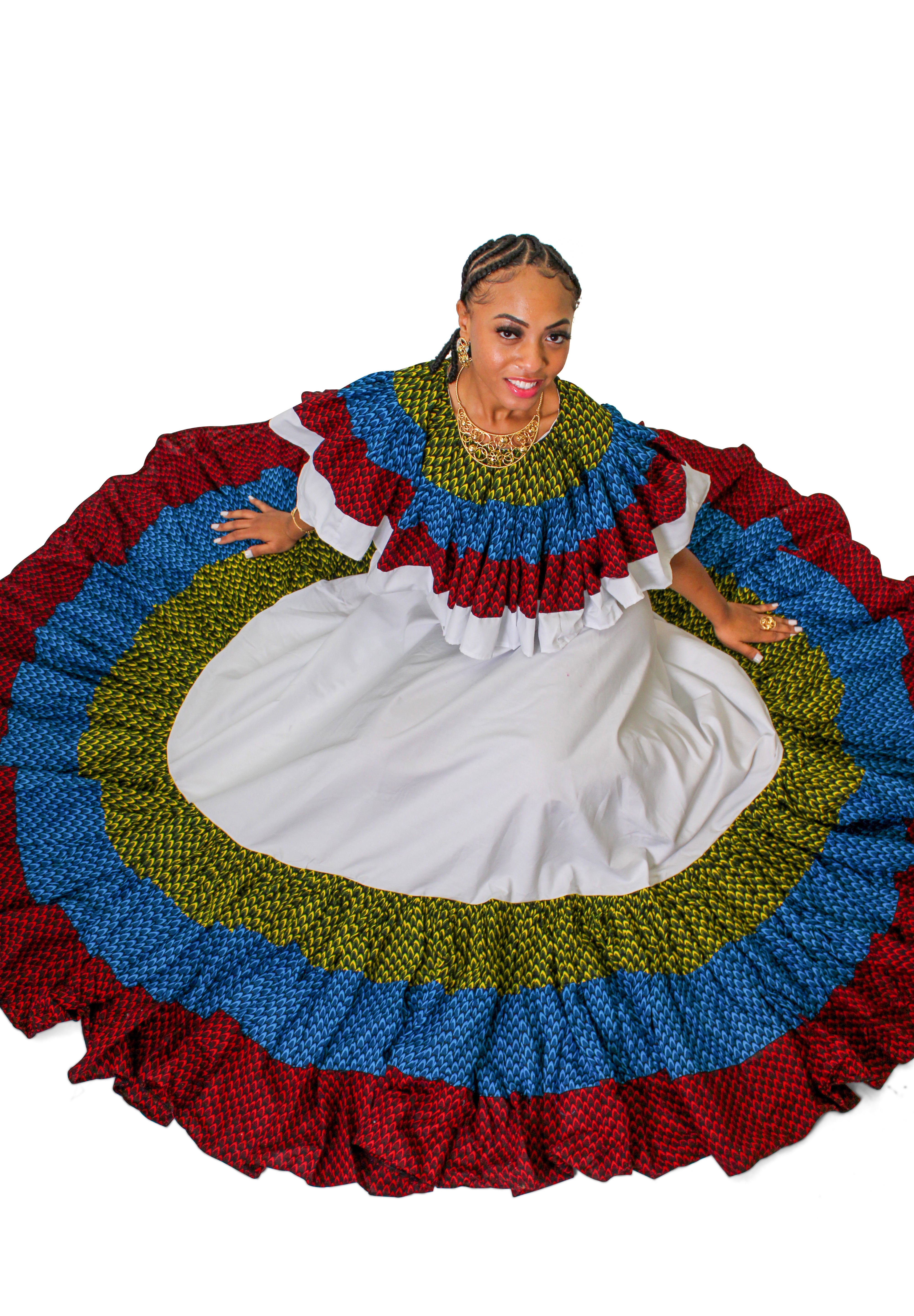 Woman wearing the Ighiligi Ruffle Dancing Dress with multicolor African ruffle detailing around the neckline and hem.