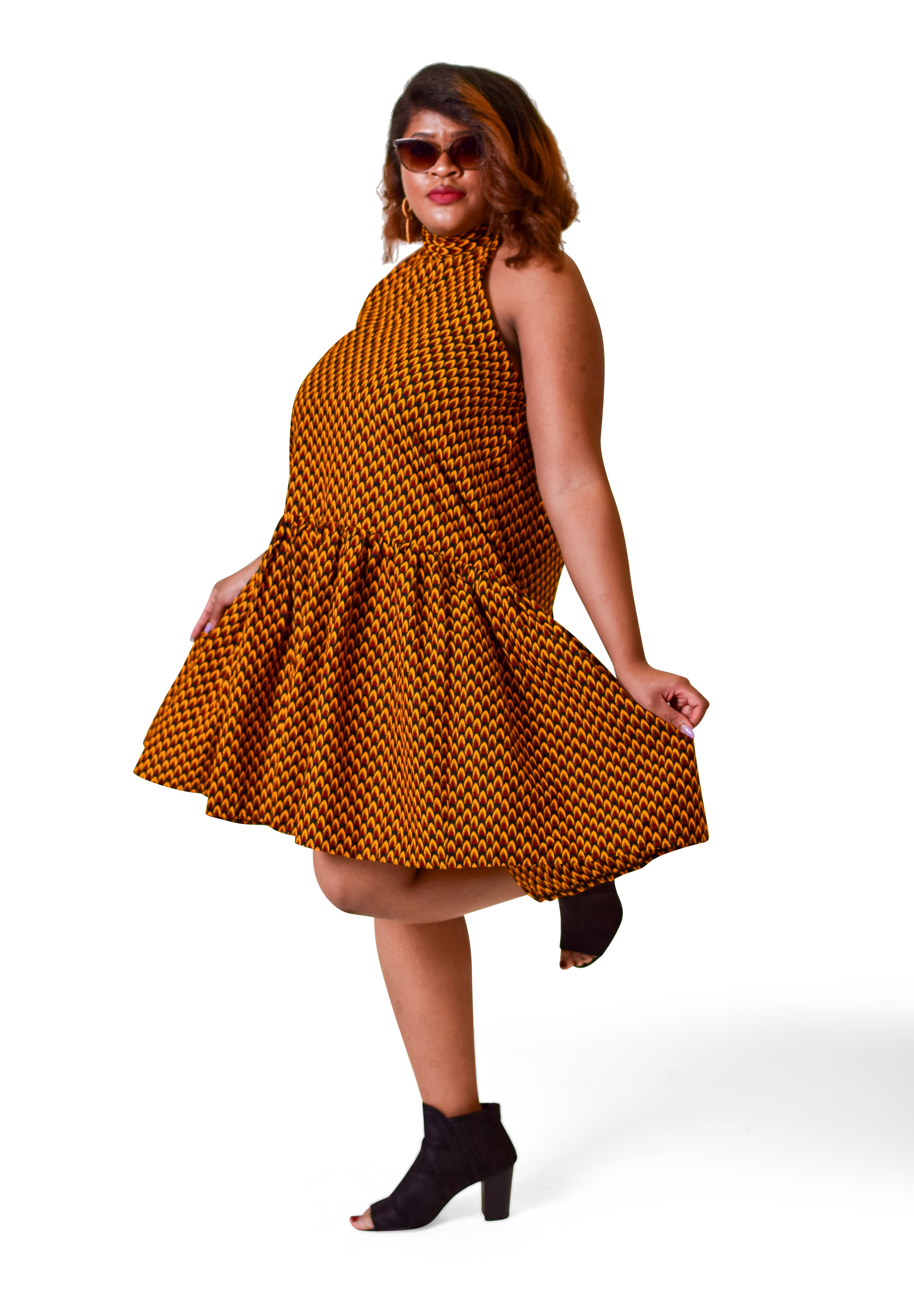 Model wearing Tuffia Ankara halter fit and flare dress handcrafted in Africa