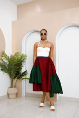 Model wearing Ankara Skirt made from red and green Ankara fabrics