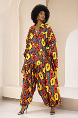 Ukwuoma Ankara faux silk two-piece set featuring an oversized button-down shirt with billowing sleeves and high-low hem, paired with voluminous harem pants with side pockets.