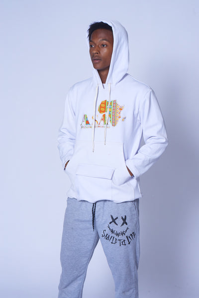 Photo of a man wearing myObioma's white college sweater, which features a hood and front pockets. It also includes a multicolor design in the center. 