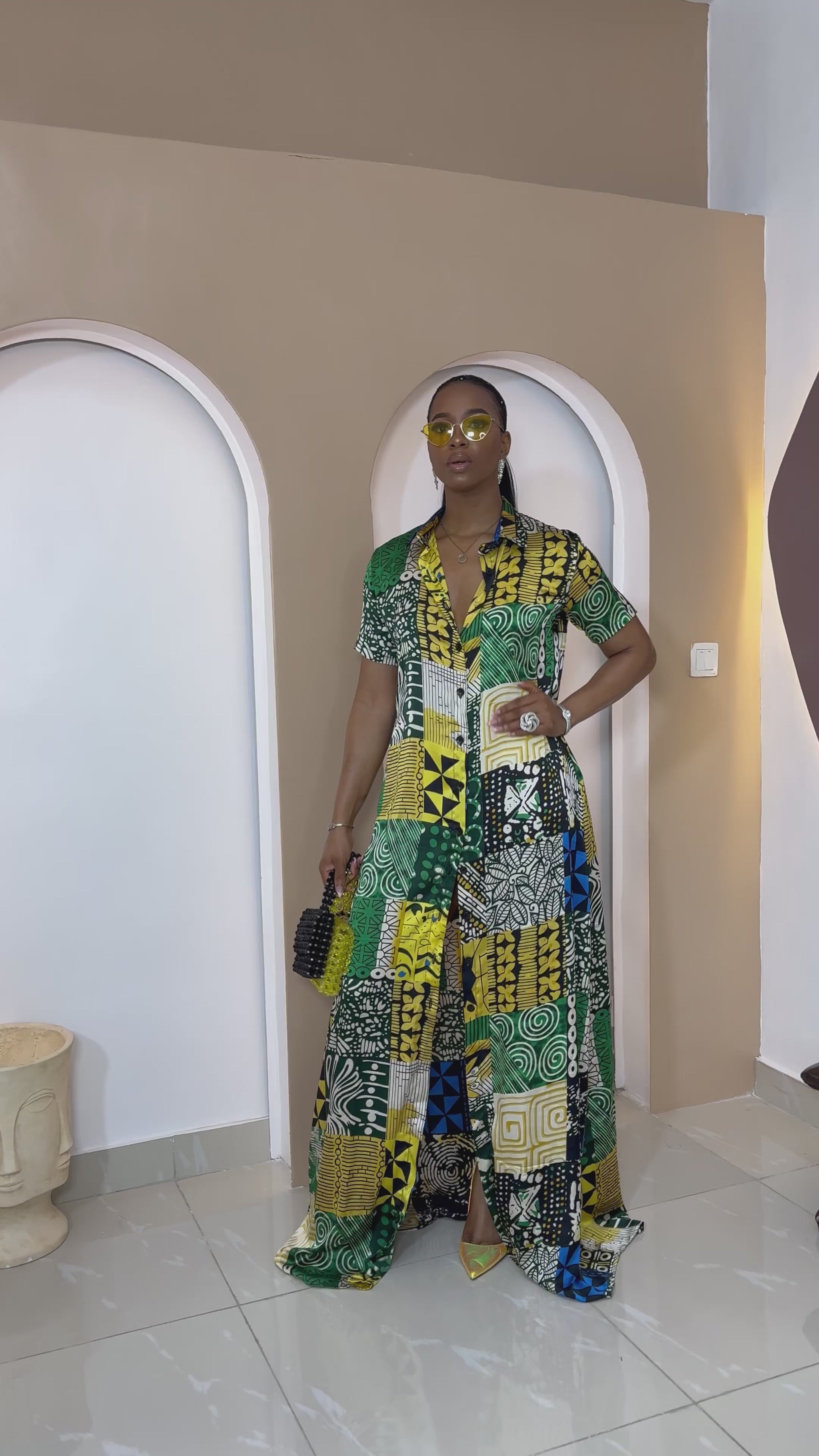 Sophisticated unlined kaftan dress made from traditional silk African Ankara fabric in vibrant multi-color patterns. Perfect for weddings, dinner parties, and formal events. Model height: 5'9".