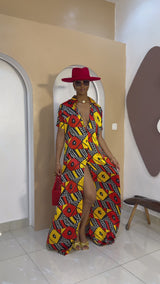 Sophisticated unlined kaftan dress made from traditional silk African Ankara fabric in vibrant multi-color patterns. Perfect for weddings, dinner parties, and formal events. Model height: 5'9".