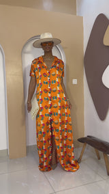 Sophisticated unlined kaftan dress made from traditional silk African Ankara fabric in vibrant multi-color patterns. Perfect for weddings, dinner parties, and formal events. Model height: 5'9".