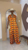 Sophisticated unlined kaftan dress made from traditional silk African Ankara fabric in vibrant multi-color patterns. Perfect for weddings, dinner parties, and formal events. Model height: 5'9".